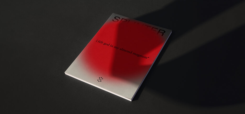 A mock-up of Splinter journal, featuring a red circle on the front cover containing the text 'I found god in my almond magnum'.